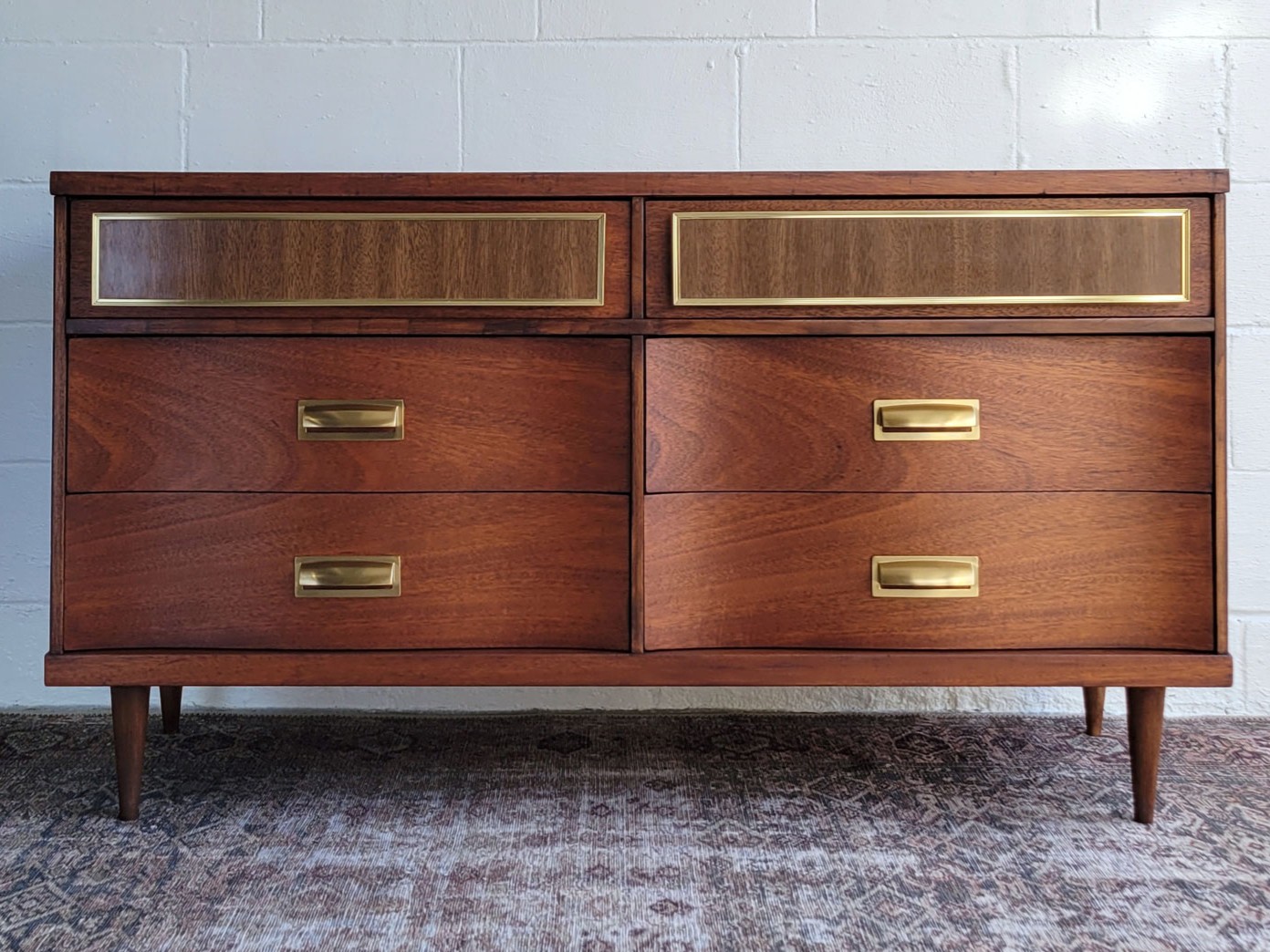 A finished vintage furniture piece restored by Moss + Amber